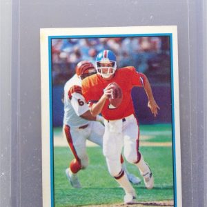 John Elway #24 1985 Topps Yearbooks Coming Soon Sticker Rookie Card